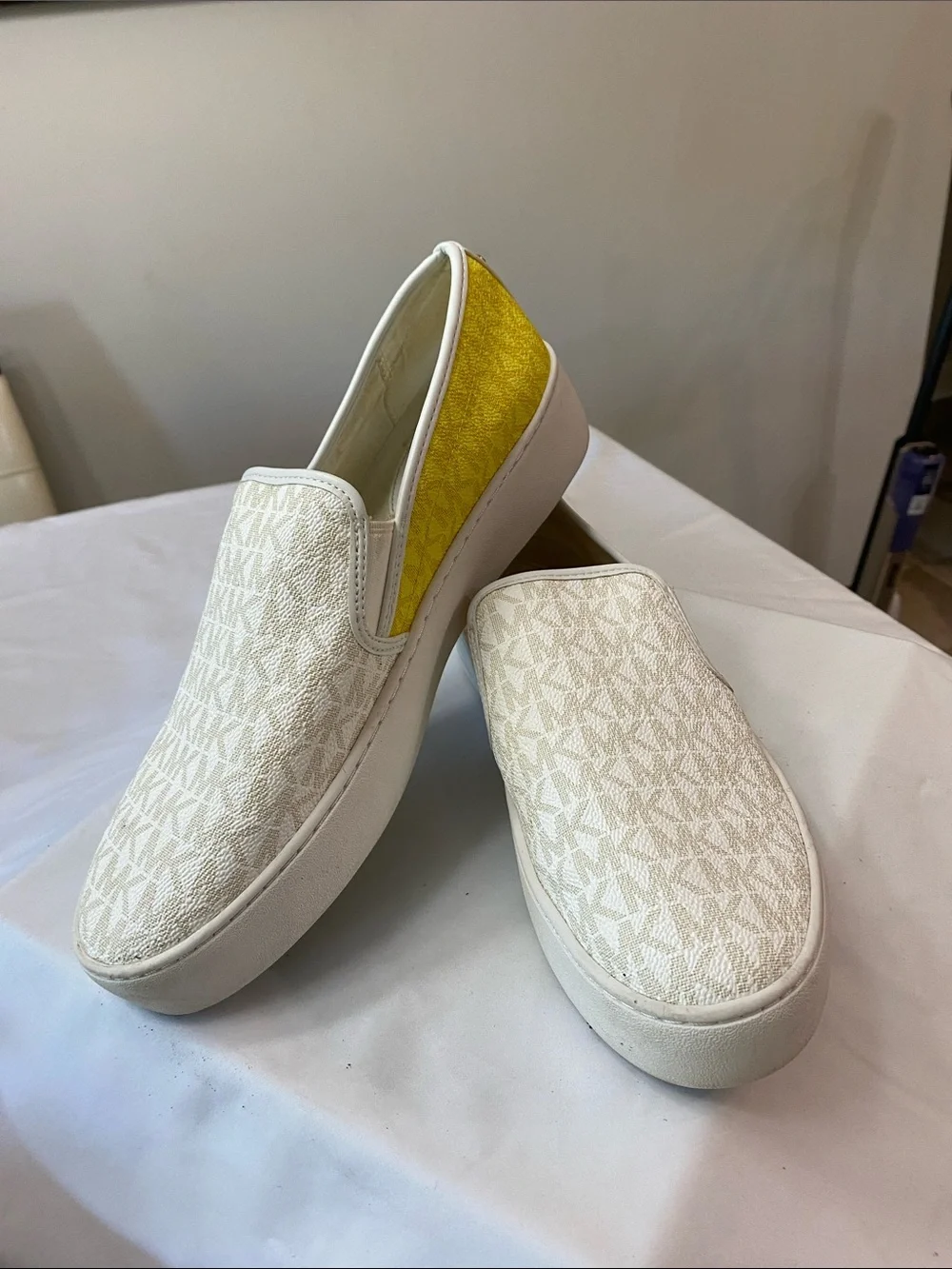 Michael Kors White Canvas Slip-On Sneakers with Yellow Heel Accent
